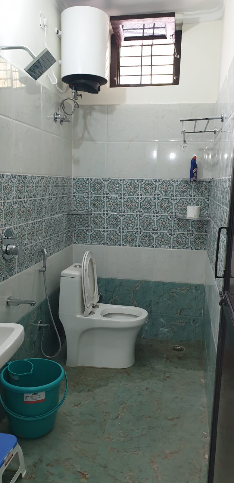 Bathroom with Moroccan tiles, shower and toilet