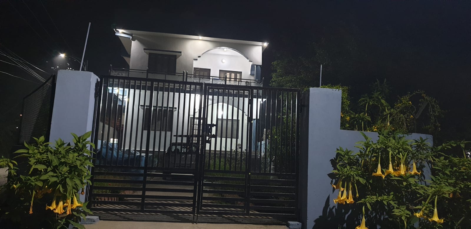 Ashirwad Homestay — Illuminated night exterior