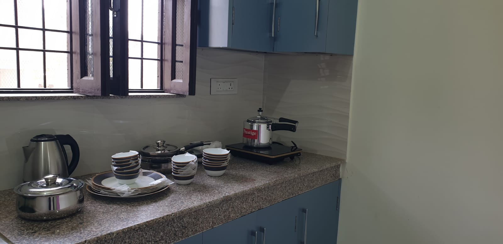 Kitchen with upper storage cabinets