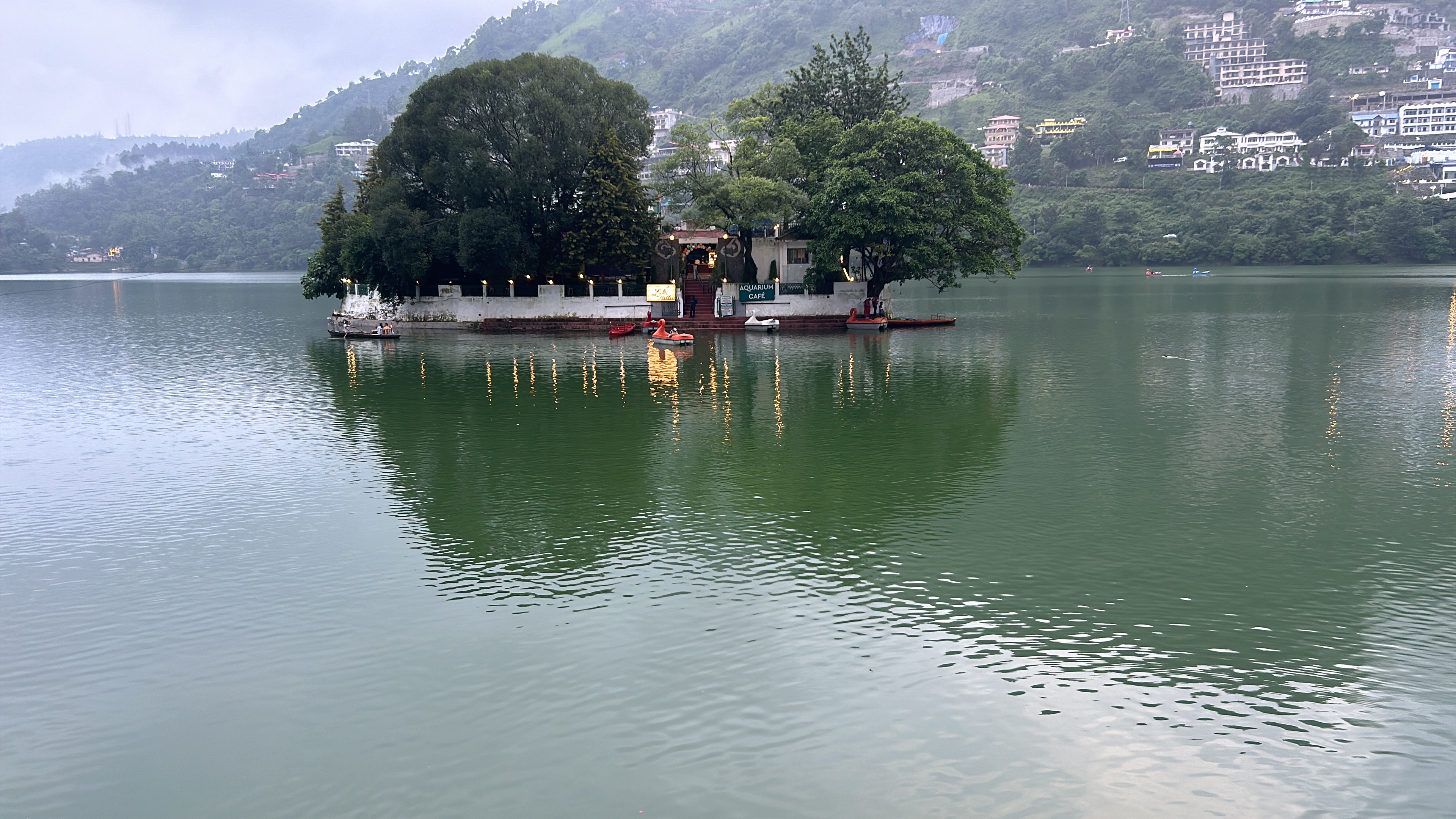 Bhimtal island temple reflected in calm water