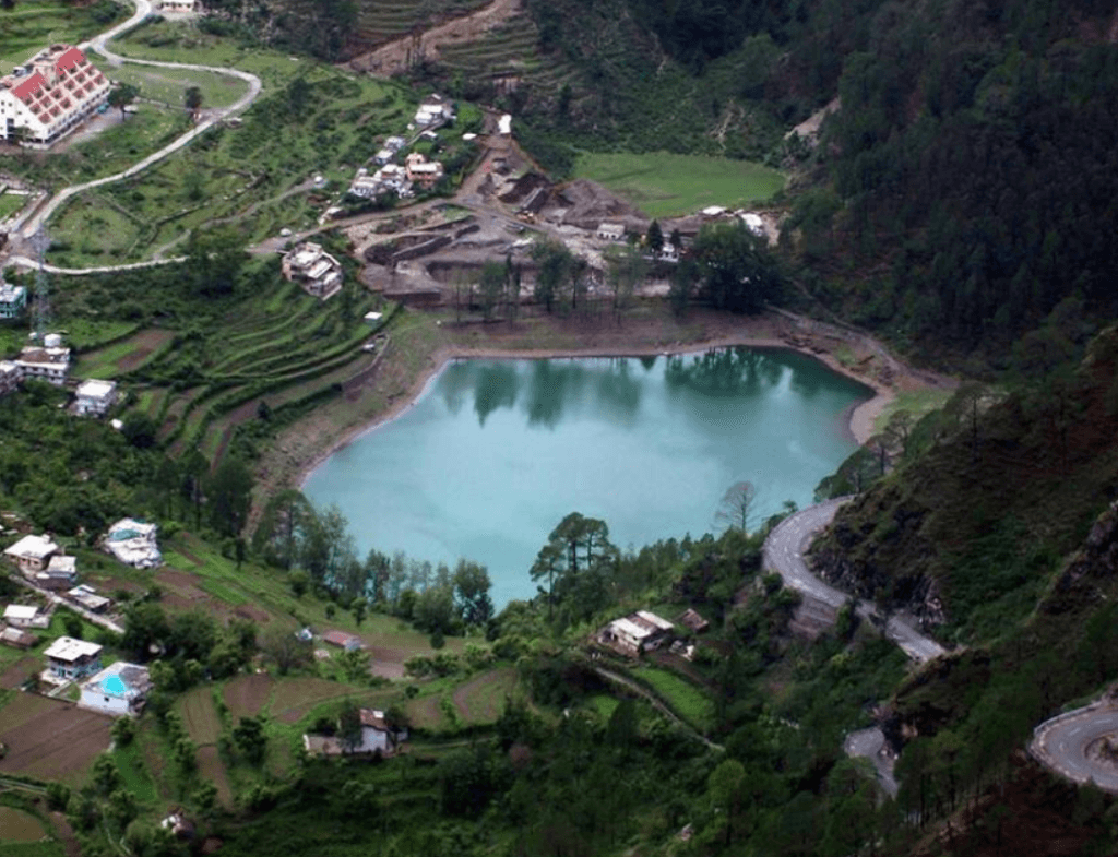 Khurpatal lake — turquoise lake seen from above with mountain village